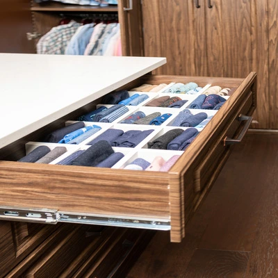 walk-in closet shoe shelves and peninsula drawers storage