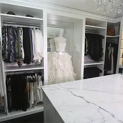 walk-in closet shoe shelves and peninsula drawers storage