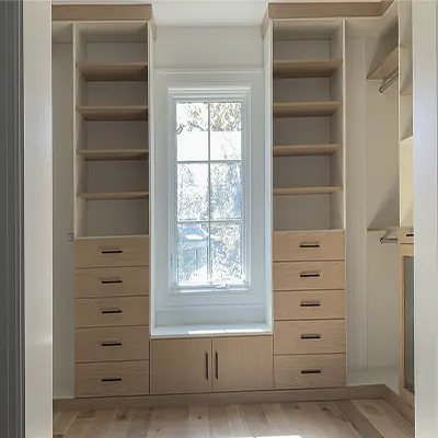 walk-in closet shoe shelves and peninsula drawers storage