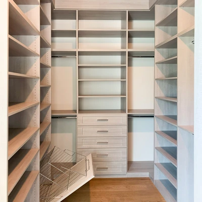 walk-in closet shoe shelves and peninsula drawers storage