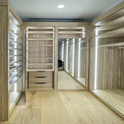 walk-in closet shoe shelves and peninsula drawers storage