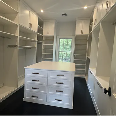 walk-in closet shoe shelves and peninsula drawers storage