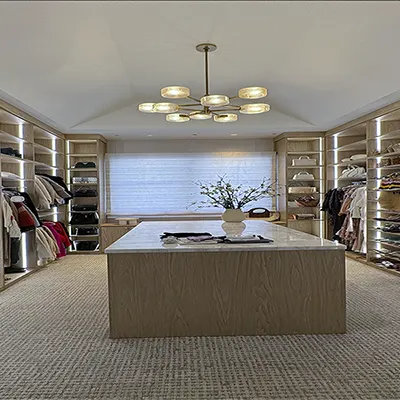 walk-in closet shoe shelves and peninsula drawers storage