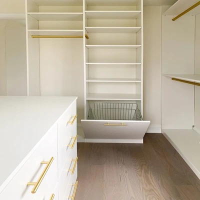 walk-in closet shoe shelves and peninsula drawers storage