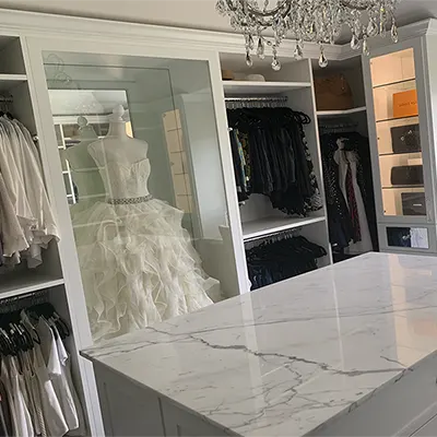 walk-in closet shoe shelves and peninsula drawers storage