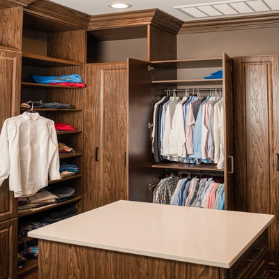 walk-in closet shoe shelves and peninsula drawers storage